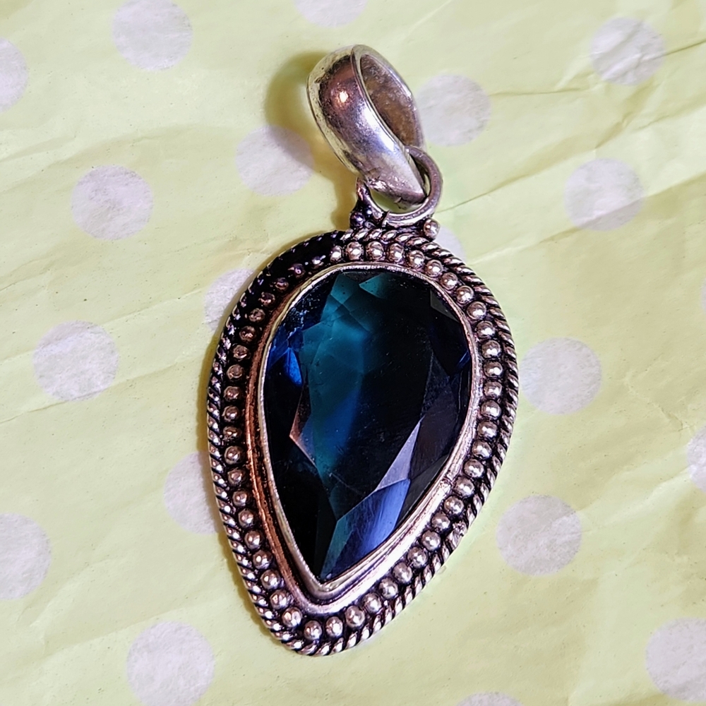 Beautiful, blue, pear-shaped, faceted faux stone pendant.